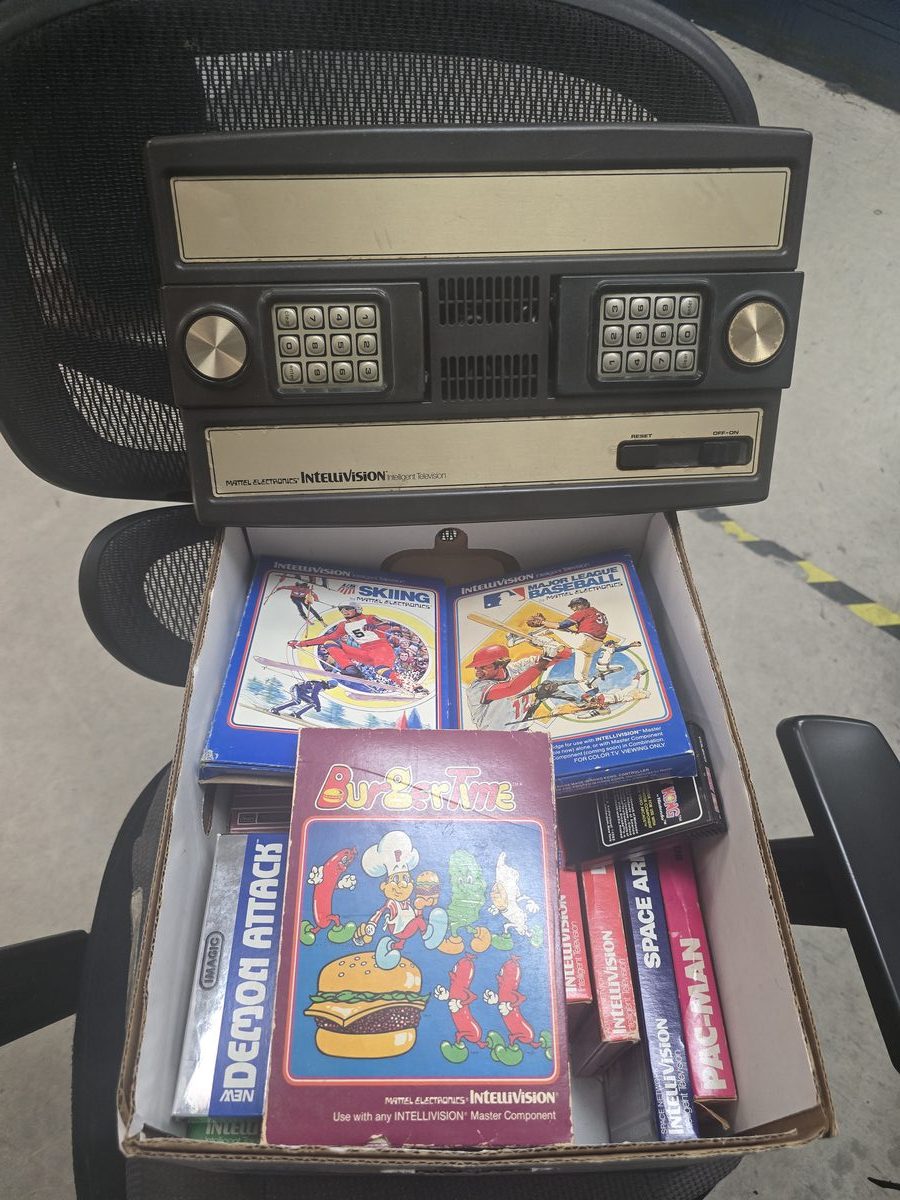 Mattel Intellivision console repair with game cartridges